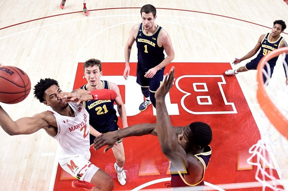 Franz Wagner (21), Hunter Dickinson (1), Eli Brooks (55), and Chaundee Brown Jr. (15)
