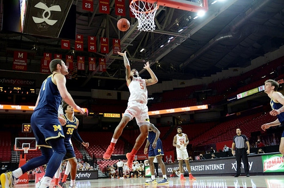 Hunter Dickinson (1), Eli Brooks (55), and Franz Wagner (21)