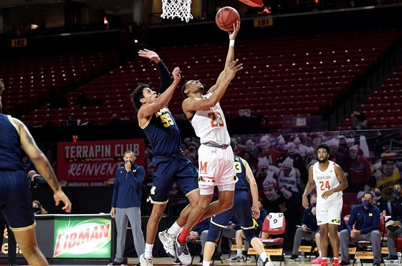 Eli Brooks (55) and Brandon Johns Jr. (23)