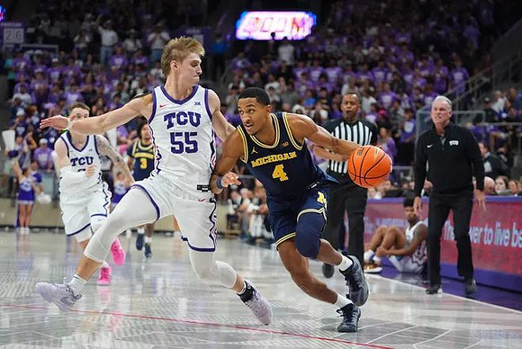 Nimari Burnett (4) and Texas Christian Head Coach Jamie Dixon