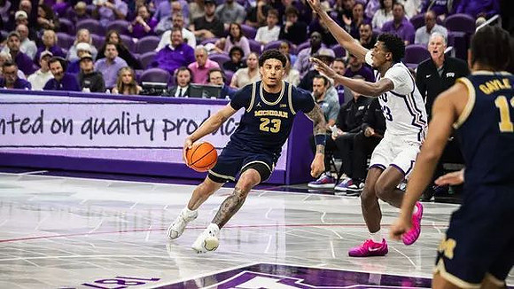 Yaxel Lendeborg (23), Roddy Gayle Jr. (11), and Texas Christian Head Coach Jamie Dixon