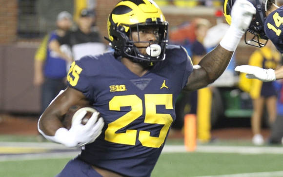 Hassan Haskins (25), and Roman Wilson (14)