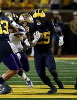 Erick All (83), and Hassan Haskins (25)