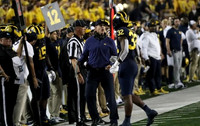 Jim Harbaugh, and Jaylen Harrell (32)