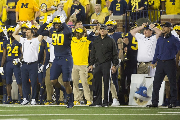Mike Morris (90), and Jim Harbaugh