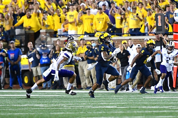Blake Corum (2), and Cornelius Johnson (6)