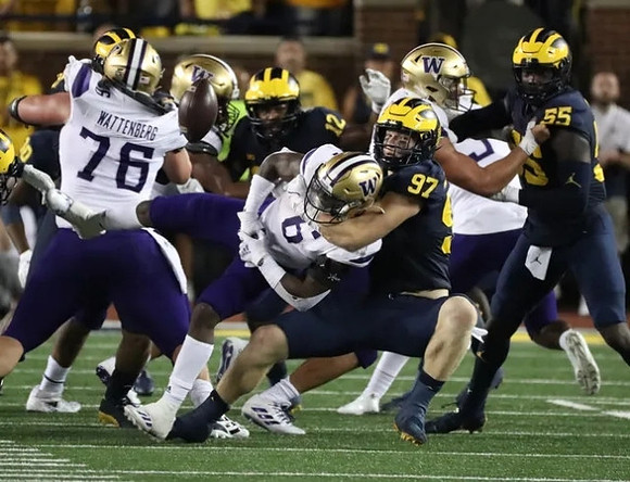 Aidan Hutchinson (97), Josh Ross (12), and David Ojabo (55)