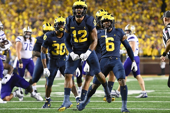 Daxton Hill (30), Josh Ross (12), and R.J. Moten (6)