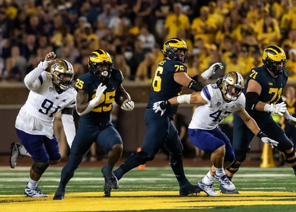 Hassan Haskins (25), Ryan Hayes (76), and Andrew Stueber (71)