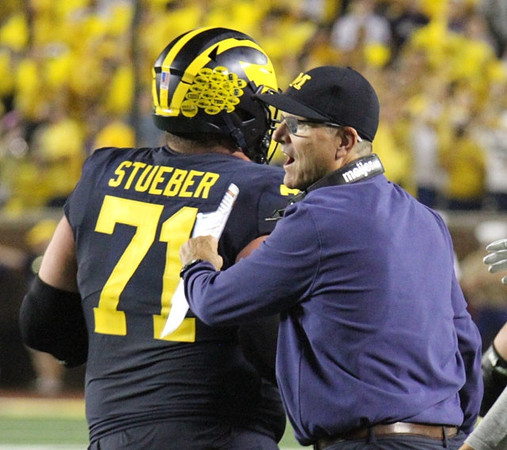 Andrew Stueber (71), and Jim Harbaugh