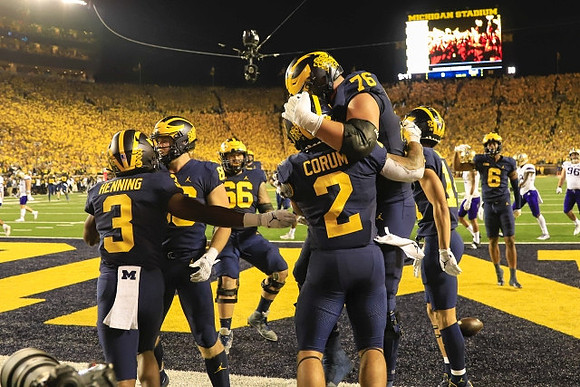 A.J. Henning (3), Chuck Filiaga (66), Blake Corum (2), Ryan Hayes (76), and Cornelius Johnson (6)