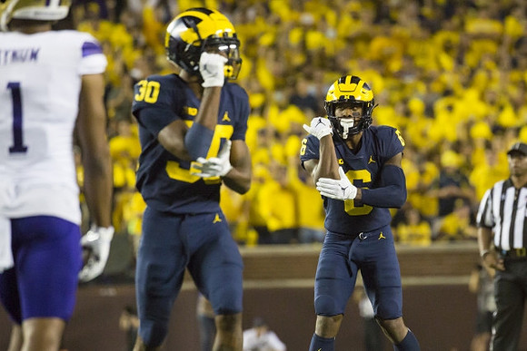 Daxton Hill (30), and R.J. Moten (6)
