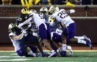 Hassan Haskins (25), and Cornelius Johnson (6)