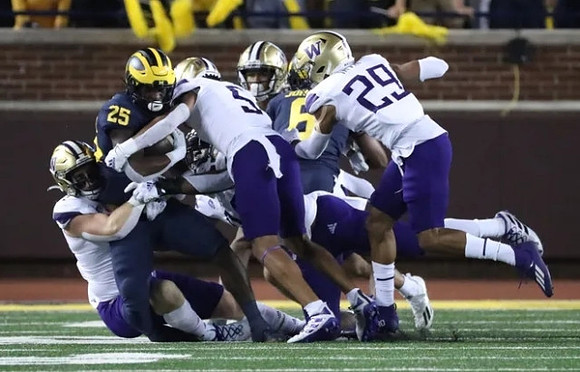 Hassan Haskins (25), and Cornelius Johnson (6)