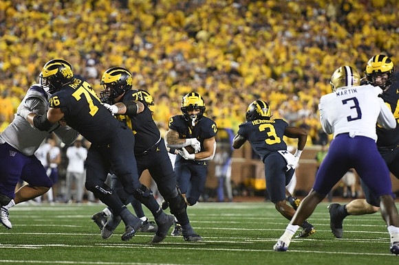 Ryan Hayes (76), Trevor Keegan (77), Blake Corum (2), and A.J. Henning (3)