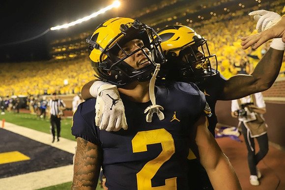 Blake Corum (2), and A.J. Henning (3)