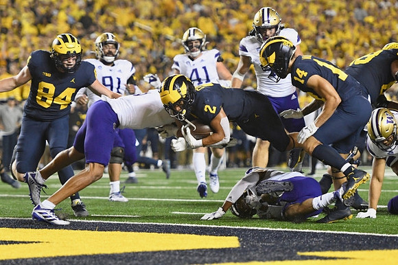 Joel Honigford (84), Blake Corum (2), and Roman Wilson (14)