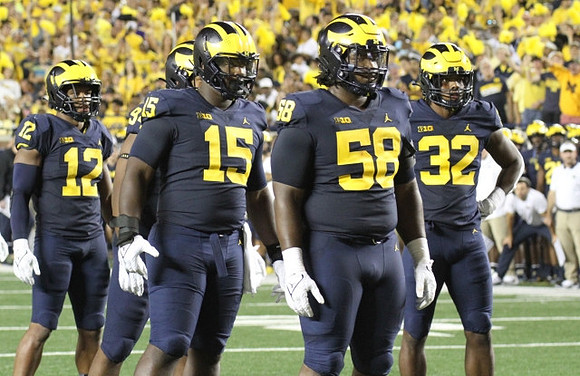 Josh Ross (12), Kris Jenkins (94), Christopher Hinton (15), Mazi Smith (58), and Jaylen Harrell (32)