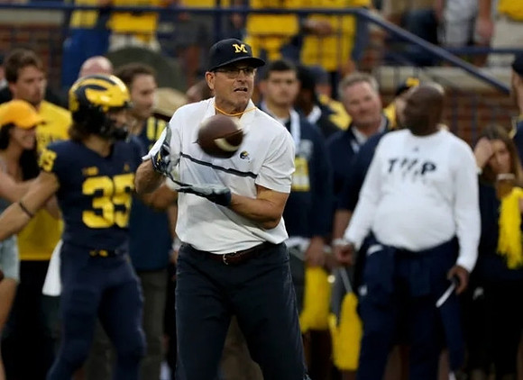Caden Kolesar (35), and Jim Harbaugh