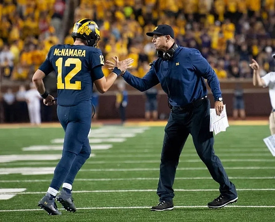 Cade McNamara (12), and Jim Harbaugh