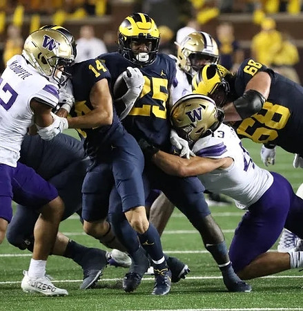 Roman Wilson (14), Hassan Haskins (25), and Andrew Vastardis (68)
