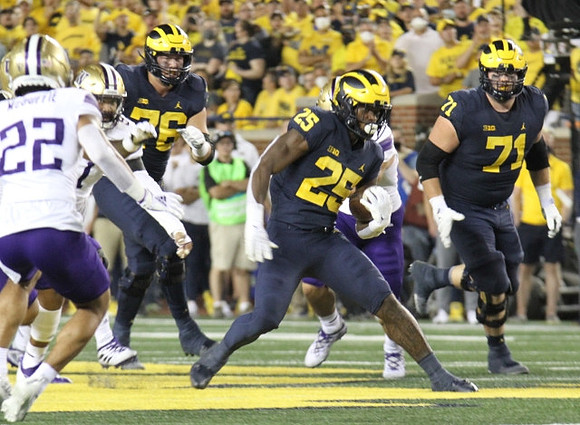 Ryan Hayes (76), Hassan Haskins (25), and Andrew Stueber (71)