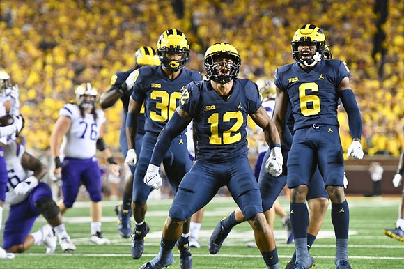 Daxton Hill (30), Josh Ross (12), and R.J. Moten (6)