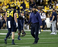 Joel Honigford (84), Jim Harbaugh, Trente Jones (53), and Greg Crippen (51)