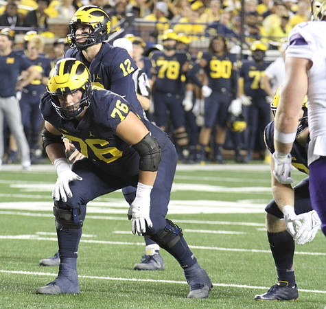 Ryan Hayes (76), and Cade McNamara (12)