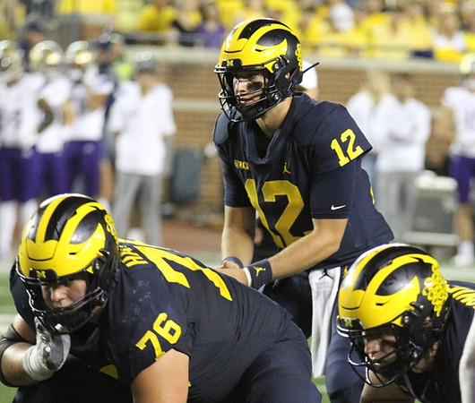 Ryan Hayes (76), and Cade McNamara (12)