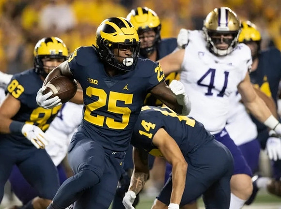 Erick All (83), Hassan Haskins (25), and Roman Wilson (14)
