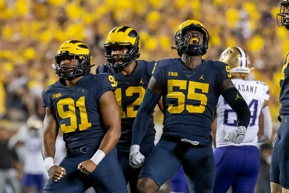Taylor Upshaw (91), Josh Ross (12), and David Ojabo (55)