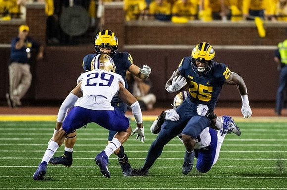 Roman Wilson (14), and Hassan Haskins (25)