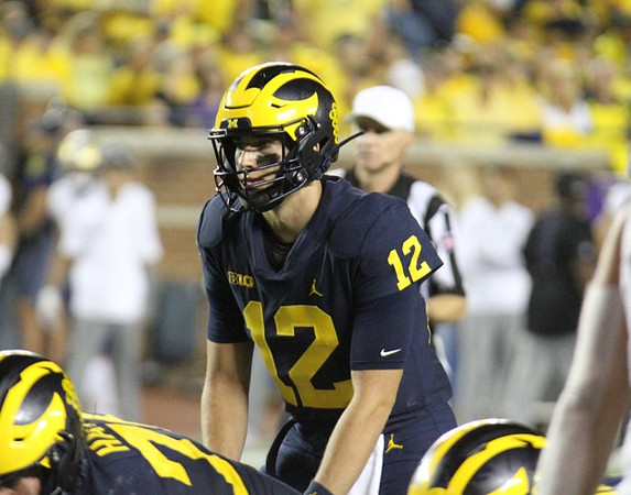 Ryan Hayes (76), and Cade McNamara (12)