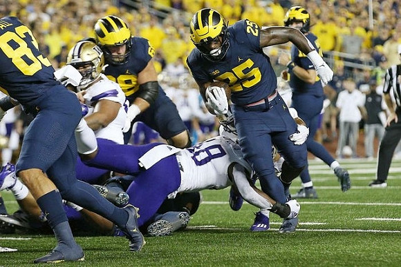 Erick All (83), Andrew Vastardis (68), Hassan Haskins (25), and Cade McNamara (12)