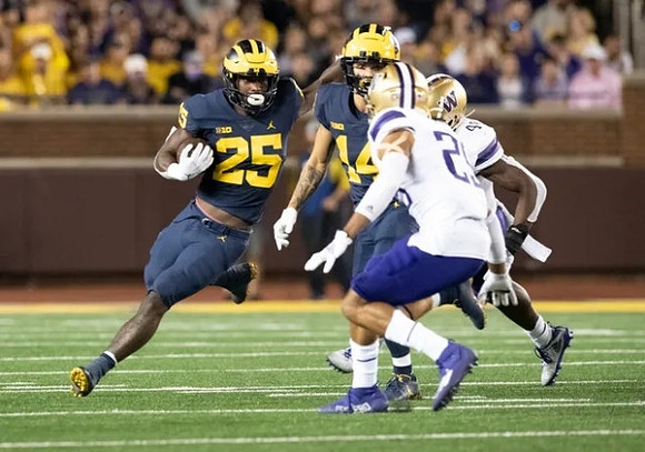 Hassan Haskins (25), and Roman Wilson (14)