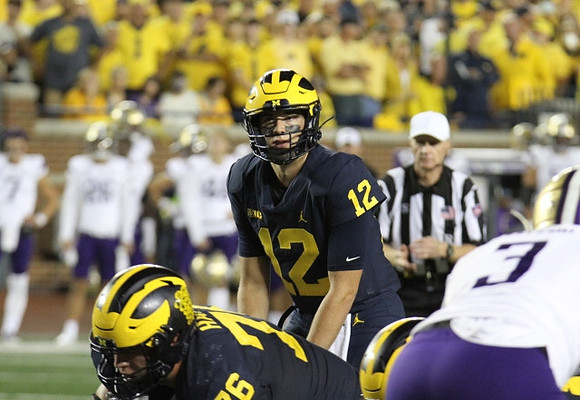 Ryan Hayes (76), and Cade McNamara (12)