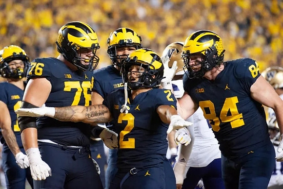 Ryan Hayes (76), Blake Corum (2), and Joel Honigford (84)