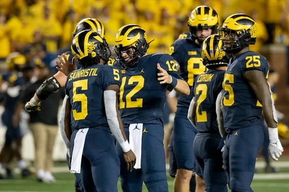 Mike Sainristil (5), Cade McNamara (12), Carter Selzer (89), Blake Corum (2), and Hassan Haskins (25)