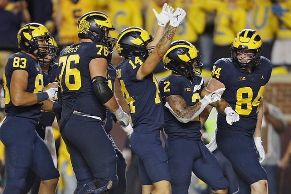 Erick All (83), Ryan Hayes (76), Roman Wilson (14), Blake Corum (2), and Joel Honigford (84)