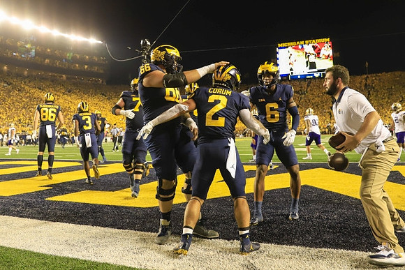 Luke Schoonmaker (86), A.J. Henning (3), Chuck Filiaga (66), Blake Corum (2), and Cornelius Johnson (6)