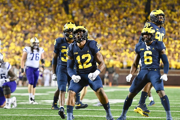 Daxton Hill (30), Josh Ross (12), R.J. Moten (6), and Mike Morris (90)