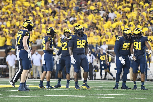 Aidan Hutchinson (97), Junior Colson (25), Josh Ross (12), Mazi Smith (58), Donovan Jeter (95), and Taylor Upshaw (91)