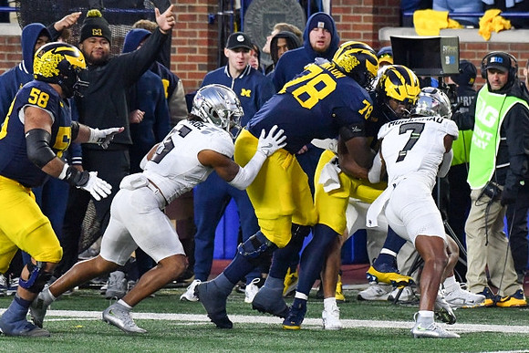 Giovanni El-Hadi (58), Myles Hinton (78), and Donovan Edwards (7)