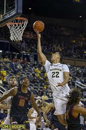 Hunter Dickinson (1), Caleb Houstan (22), and Terrance Williams II (5)