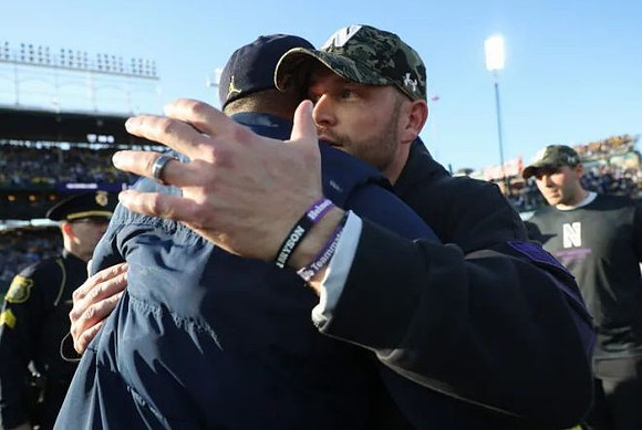 Sherrone Moore and Northwestern Head Coach David Braun