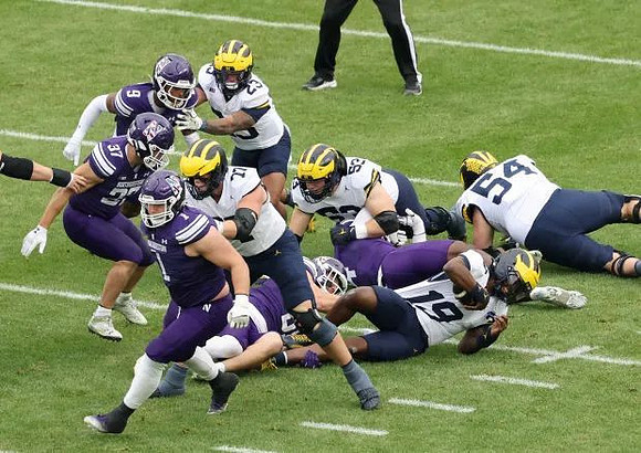 Bryce Underwood (19), Jordan Marshall (23), Blake Frazier (77), and Andrew Sprague (54)