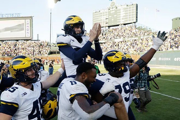 Dominic Zvada (96) and Michigan Team