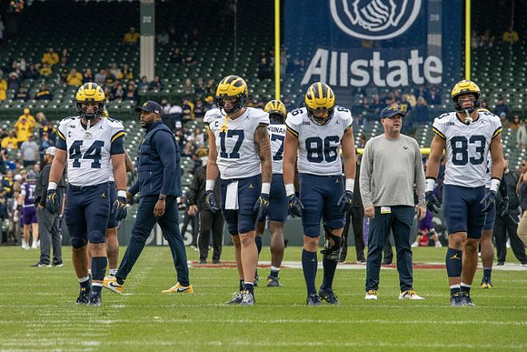 Max Bredeson (44), Sherrone Moore, Marlin Klein (17), Chibi Anwunah (97), Brady Prieskorn (86), and Zack Marshall (83)