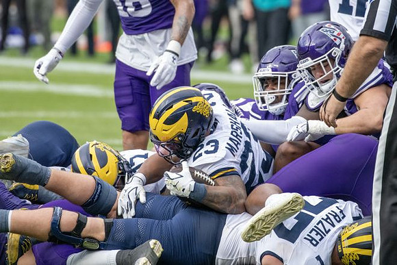 Jordan Marshall (23), Blake Frazier (77), and Marlin Klein (17)